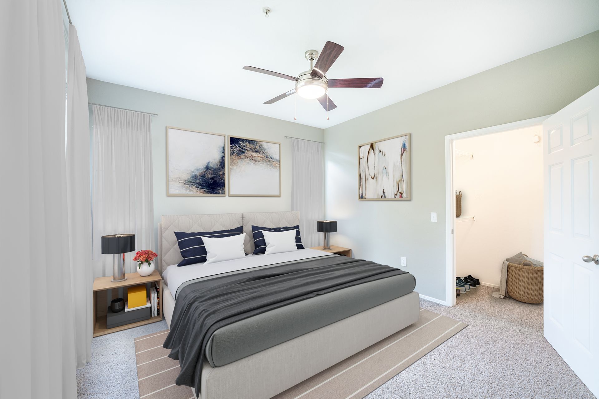 A bedroom with a large bed and a ceiling fan at Marquis Champions Forest, offers apartments for rent near Champions, Houston.