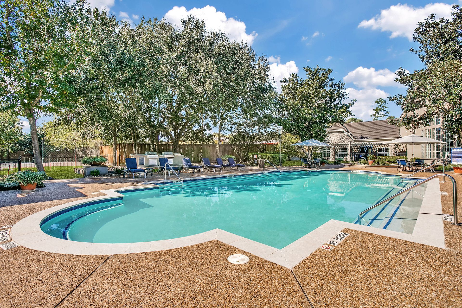 A large swimming pool at Marquis Champions Forest, offers apartments for rent near the Champions area.