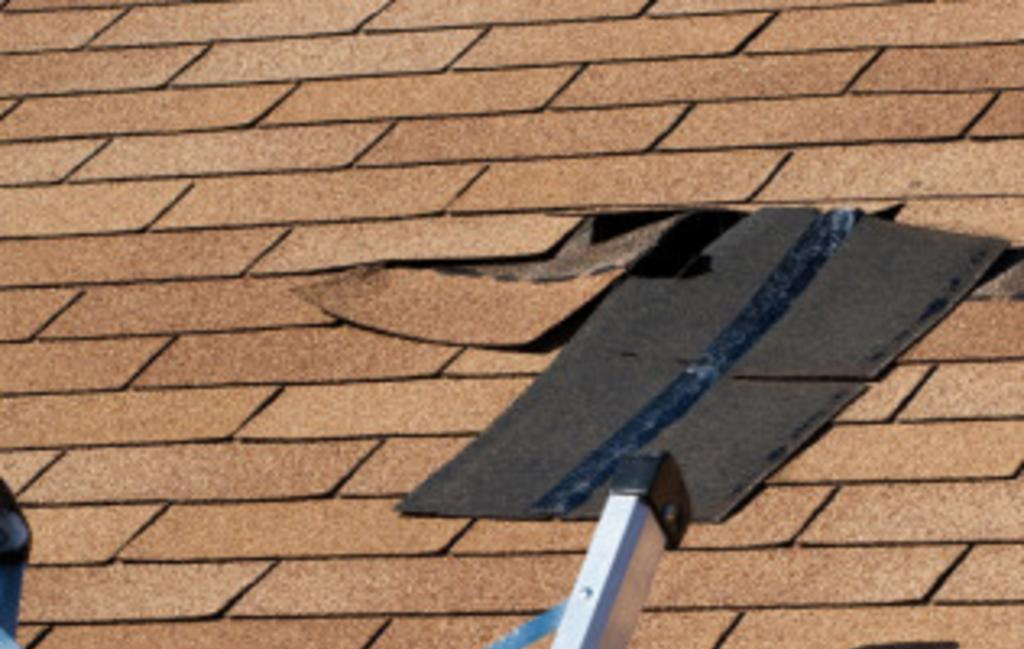 Brown roof with roofing damage