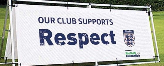 Banner on green grass that reads 