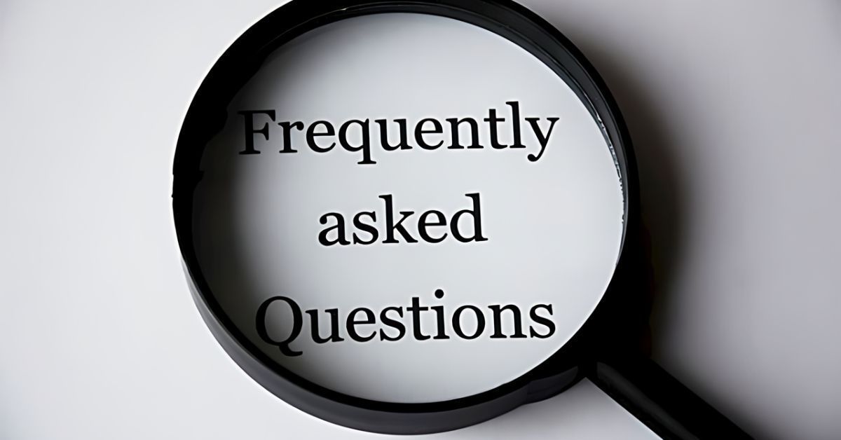 Magnifying glass over the words “Frequently asked Questions” on a white background
