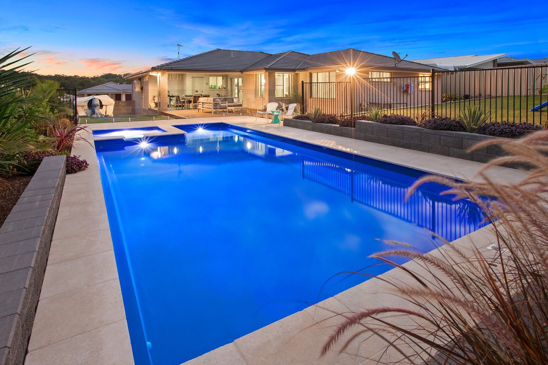 A Rectangular Blue Pool On The Yard