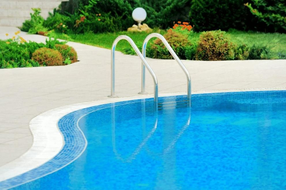 Swimming Pool With Stairs Leading Up to It — Gibson Family Pools Pty Ltd In Port Macquarie, NSW