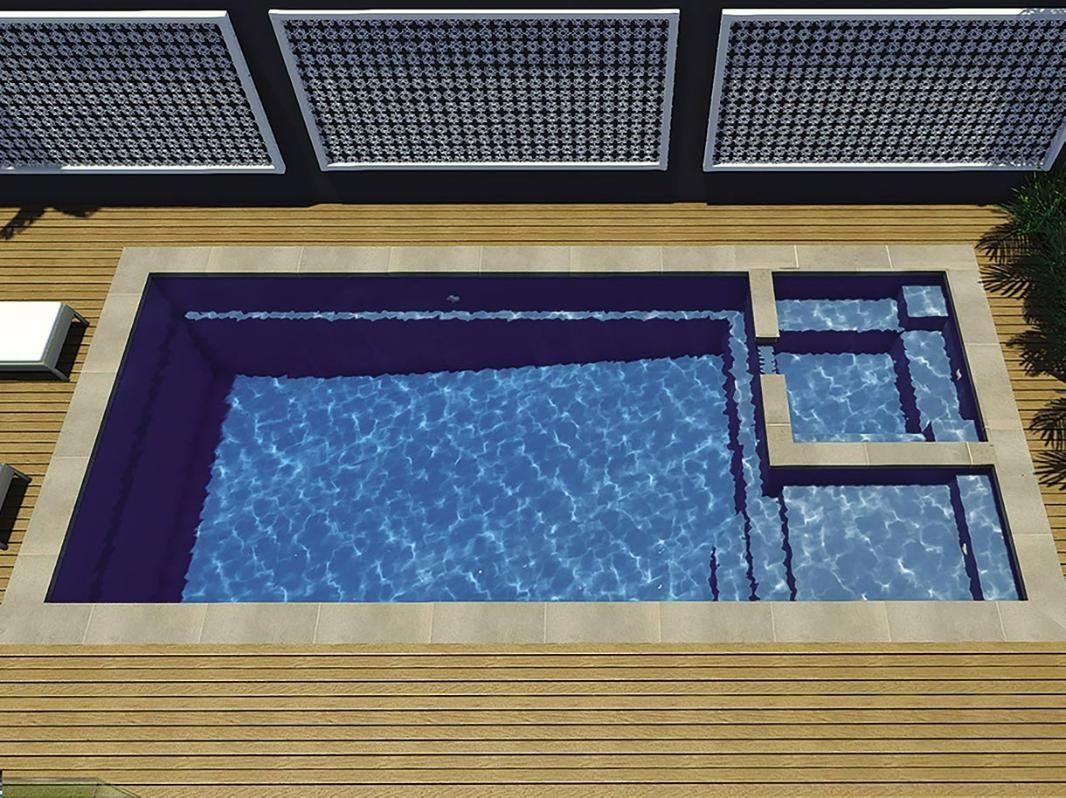 An Aerial View Of A Large Swimming Pool On A Wooden Deck — Gibson Family Pools Pty Ltd In Port Macquarie, NSW