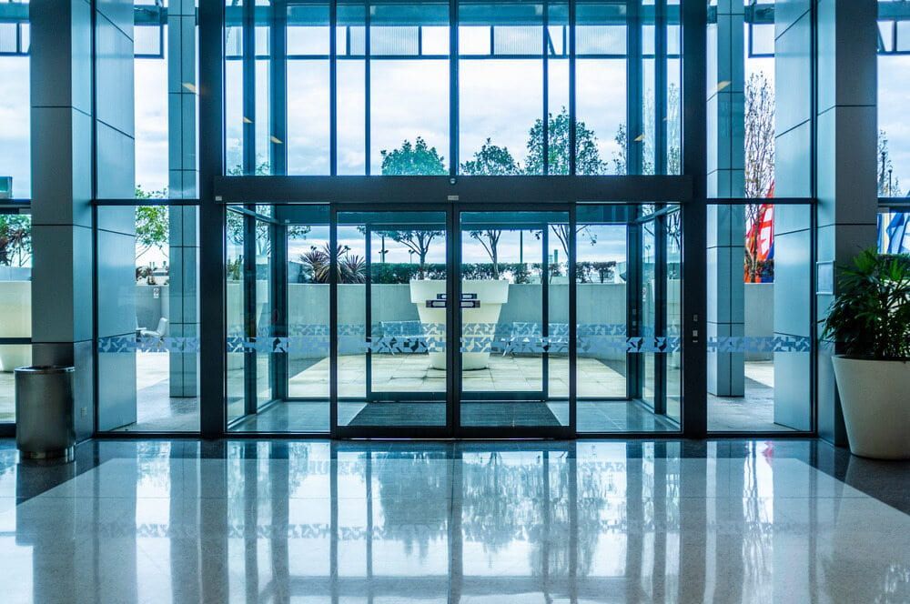 A Large Building With a Sliding Glass Door and a Large Window — Orana Glass In Dubbo, NSW
