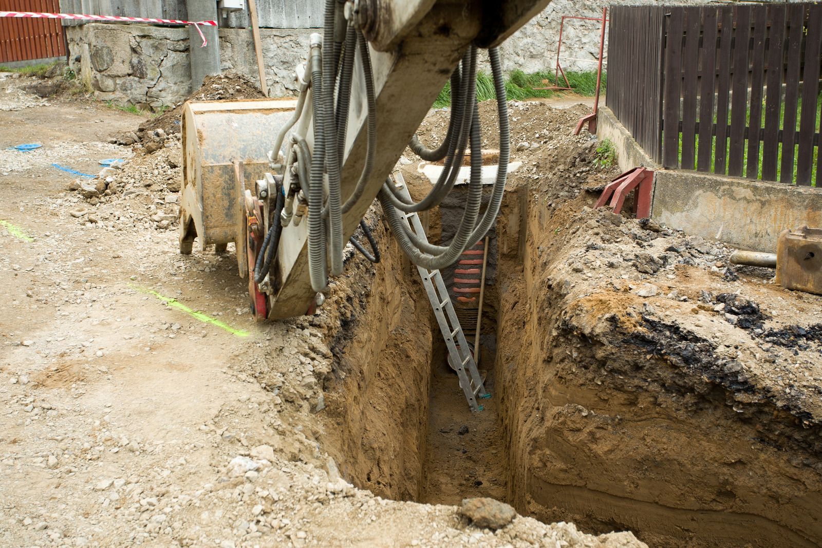 A large excavator is digging a hole in the ground.