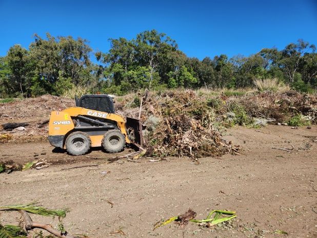 A Bulldozer Is Moving A Pile Of Dirt In A Field — Rockyview Excavations In Rockyview, QLD