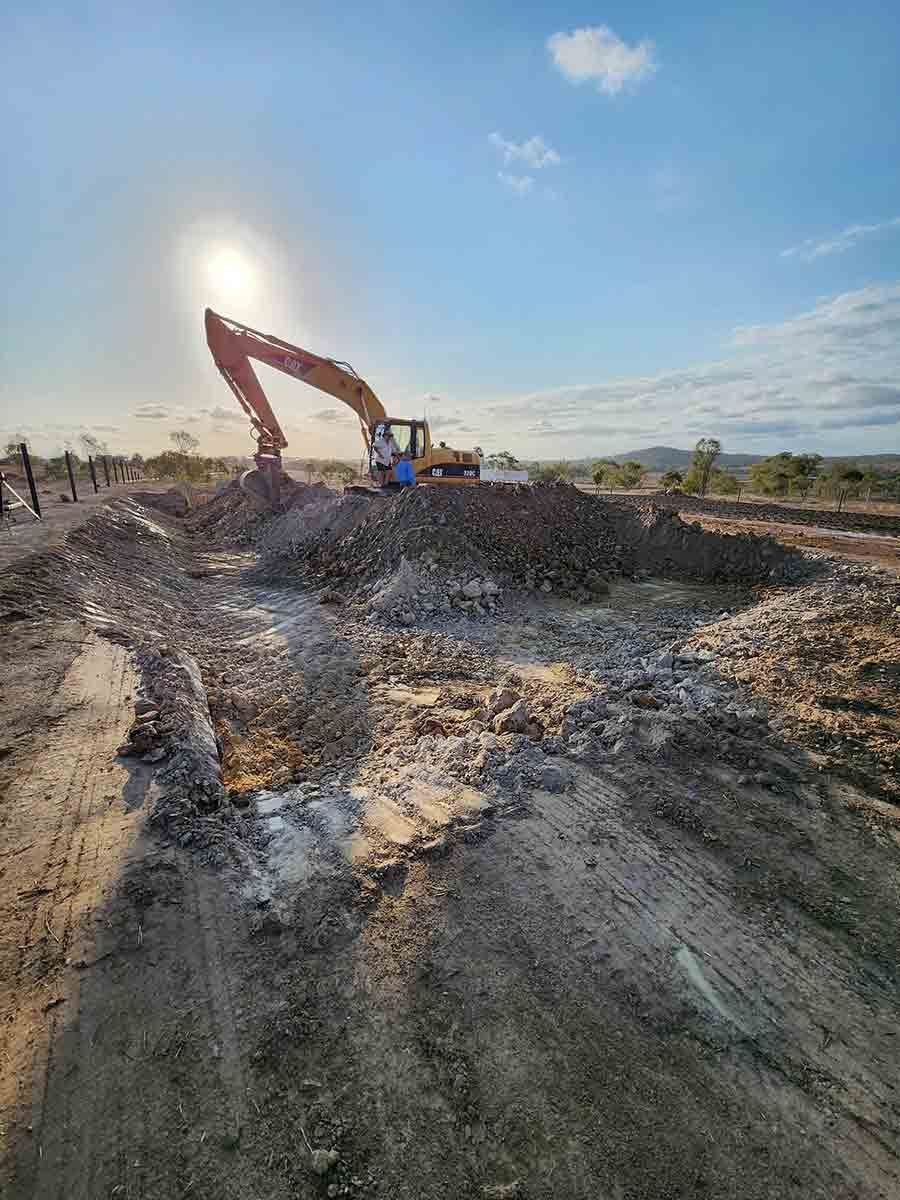 A Large Excavator Is Working On A Dirt Road — Rockyview Excavations In Rockyview, QLD
