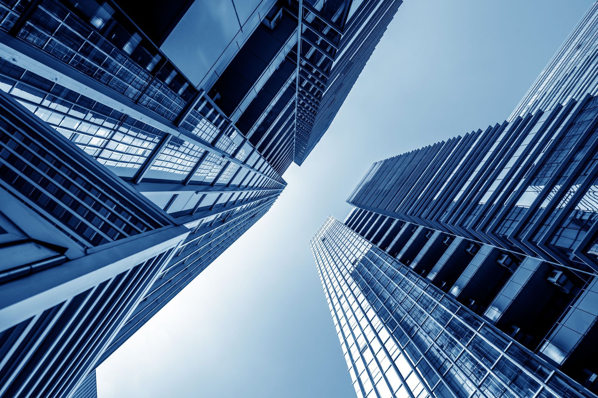 Photo looking up at tall city buildings