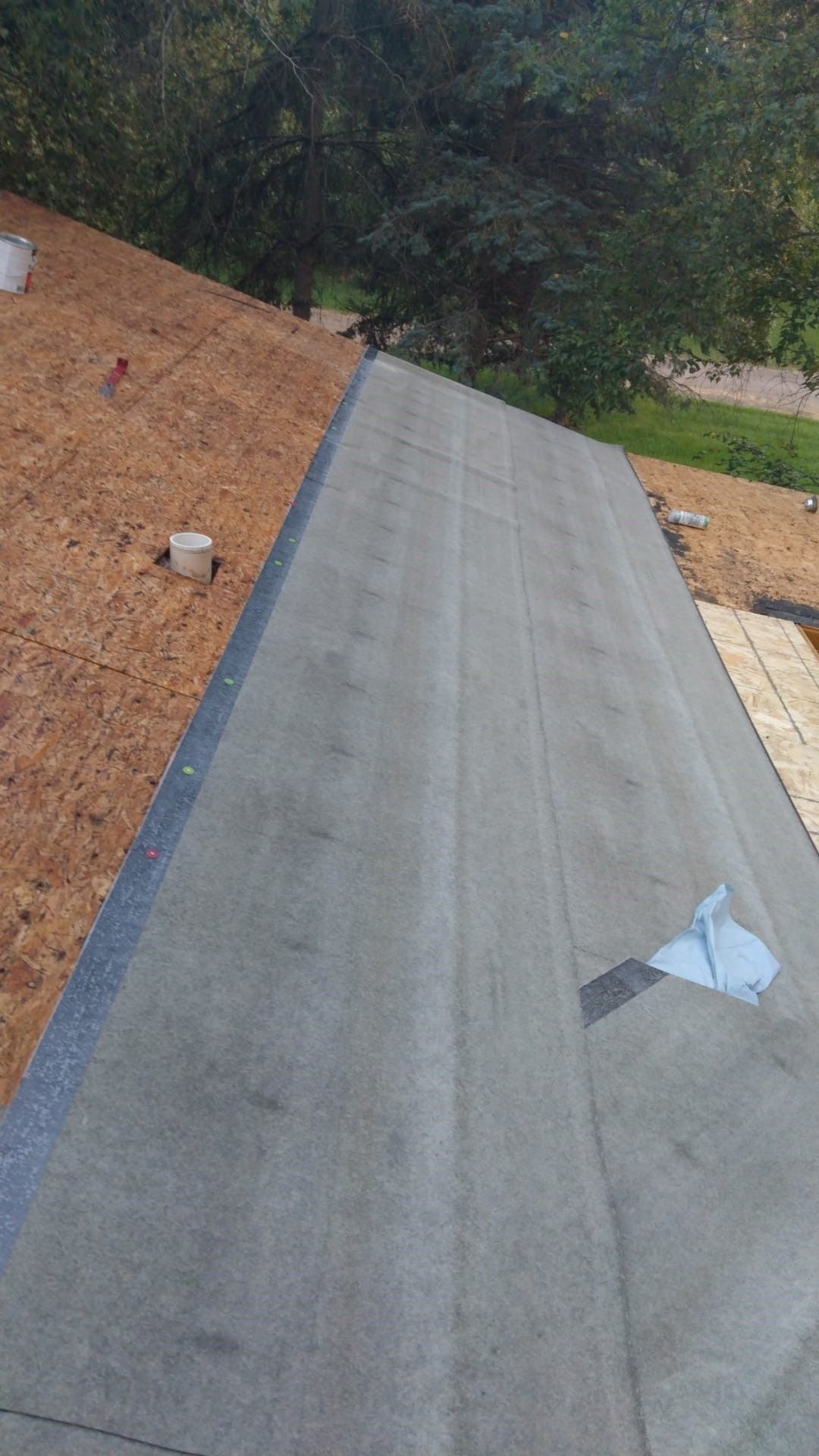 Installing Rubber Roof — Minneapolis, MN — Pristine Exteriors LLC