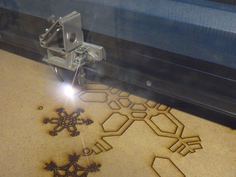 Laser cutting shapes into metal