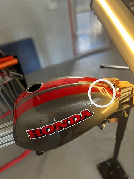 A Honda Motorcycle Is Sitting on A Table — Dent Motive in Nerang, QLD