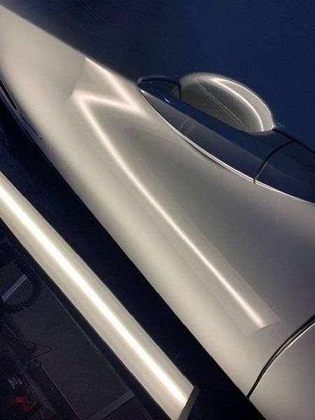 A Close-up Of a White Car with A Blue Sky in The Background — Dent Motive in Nerang, QLD