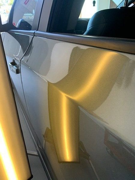 A Car with A Dent on The Side of It — Dent Motive in Nerang, QLD