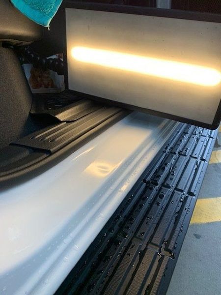 A White Car with A Light on The Side of It — Dent Motive in Nerang, QLD