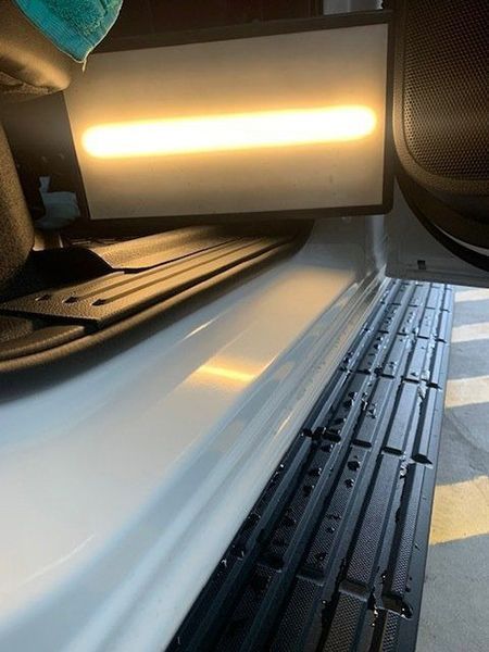 A Close-up Of a Car Door with A Light on It — Dent Motive in Nerang, QLD