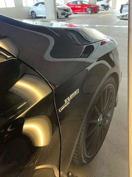 A Black Car with The Word Turbo on The Side — Dent Motive in Nerang, QLD