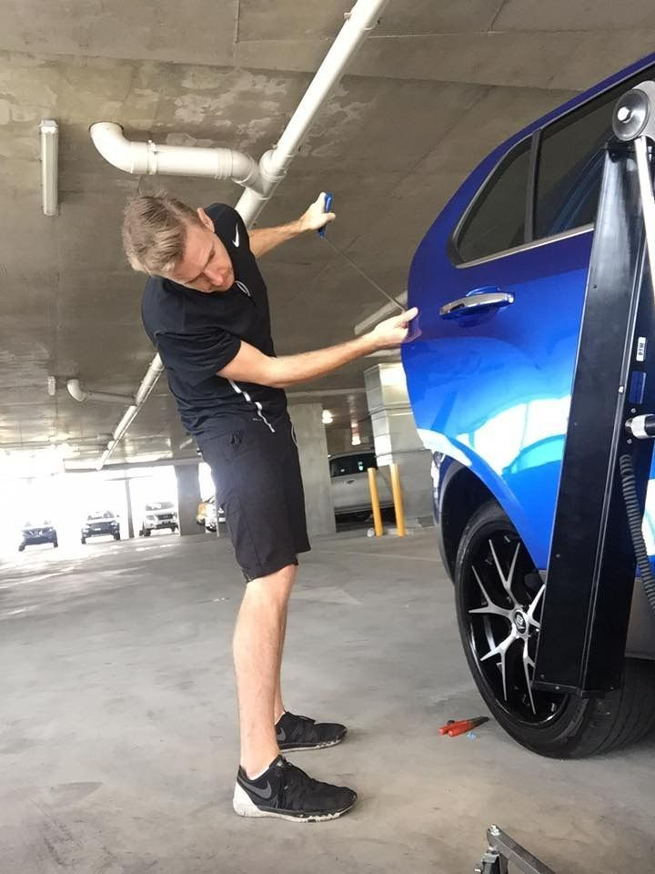 Men Worker Repairing The Dent Blue Car — Dent Motive in Nerang, QLD