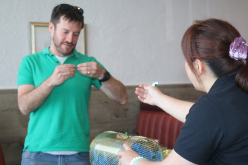 Young Man Picking A Prize From The Roulette Cage - Sacramento, CA - Far East Café