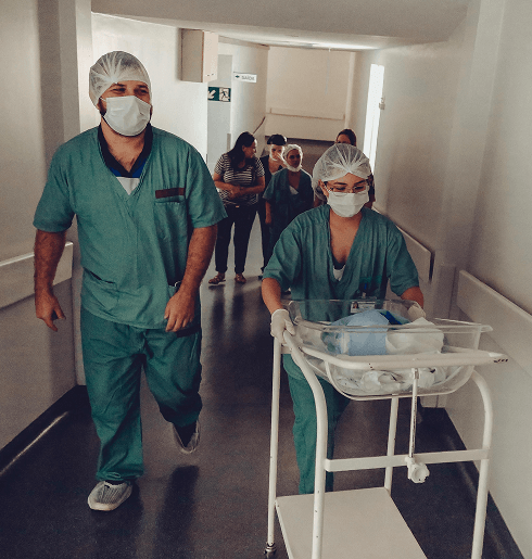 Healthcare professionals walking down hallway