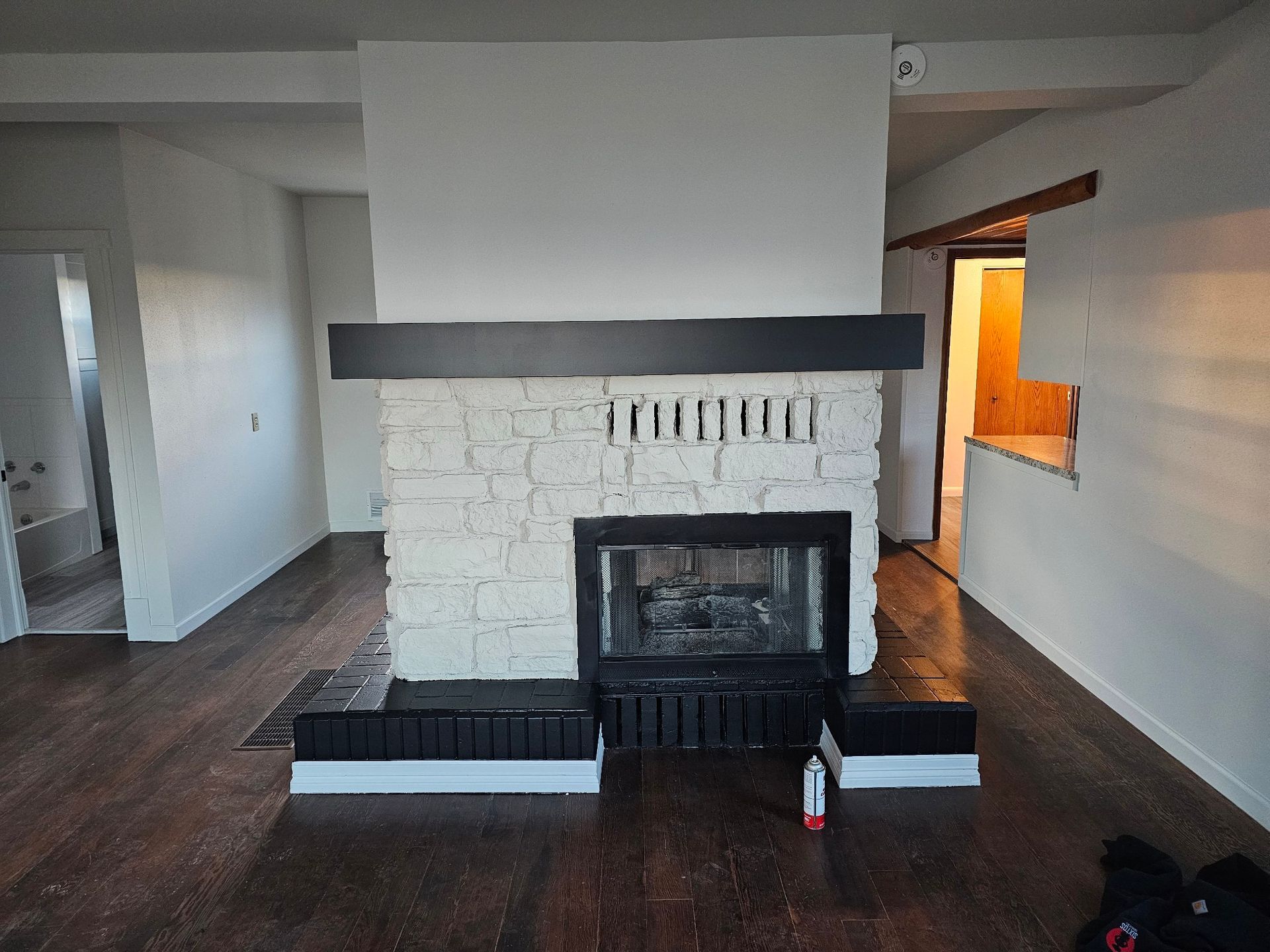 There is a fireplace in the middle of the room.