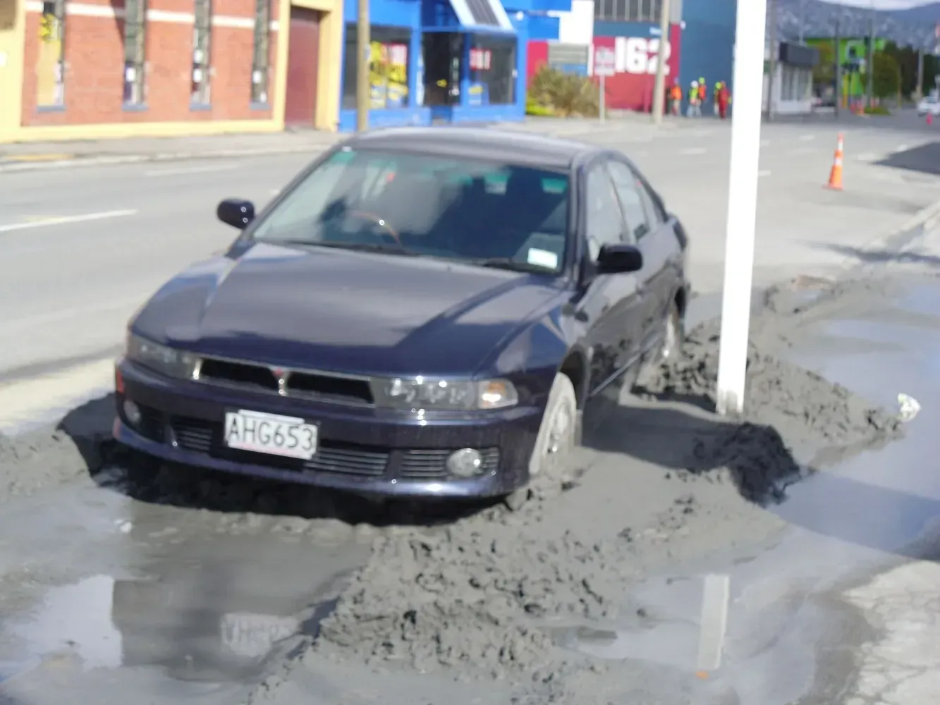 A black car with a license plate that says hfr650