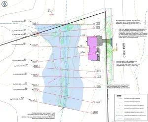 A blueprint of a house with a purple building in the middle of a field.