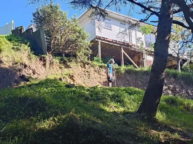 A drone is sitting on the ground in a parking lot.