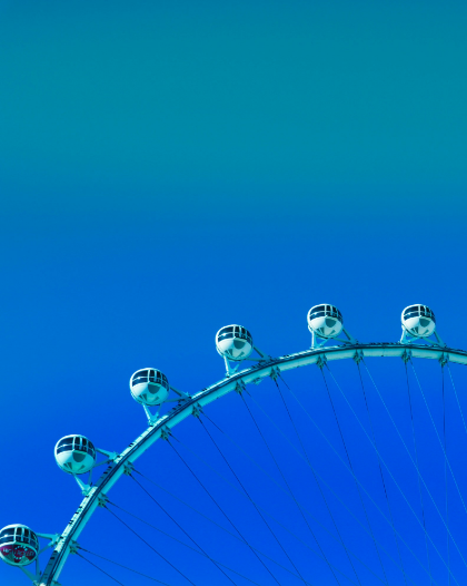 A ferris wheel with a blue sky in the background.