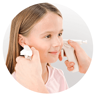 young girl being pierced by Blomdahl system