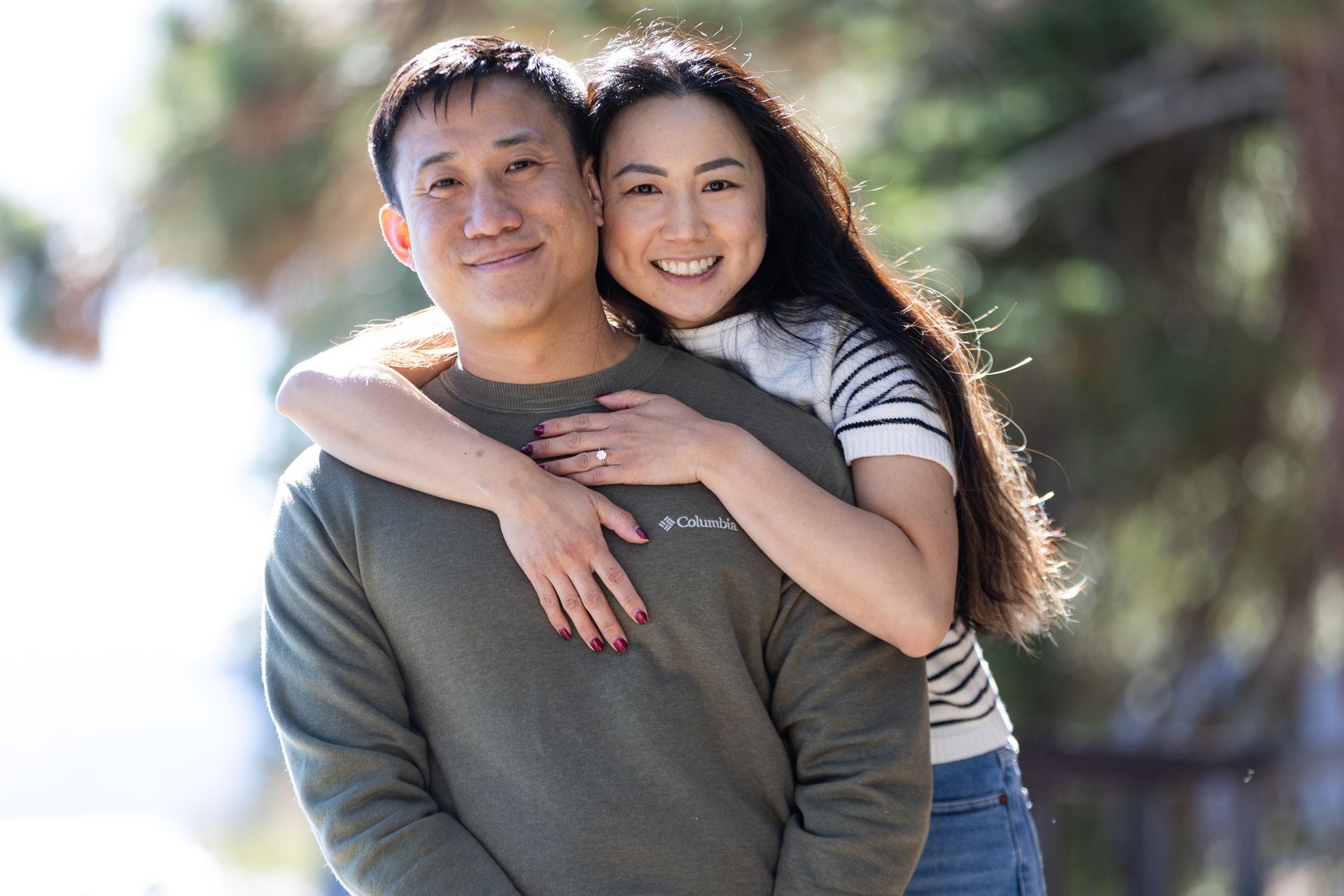 West shore Lake Tahoe engagement session with couple walking along the beach after saying yes.