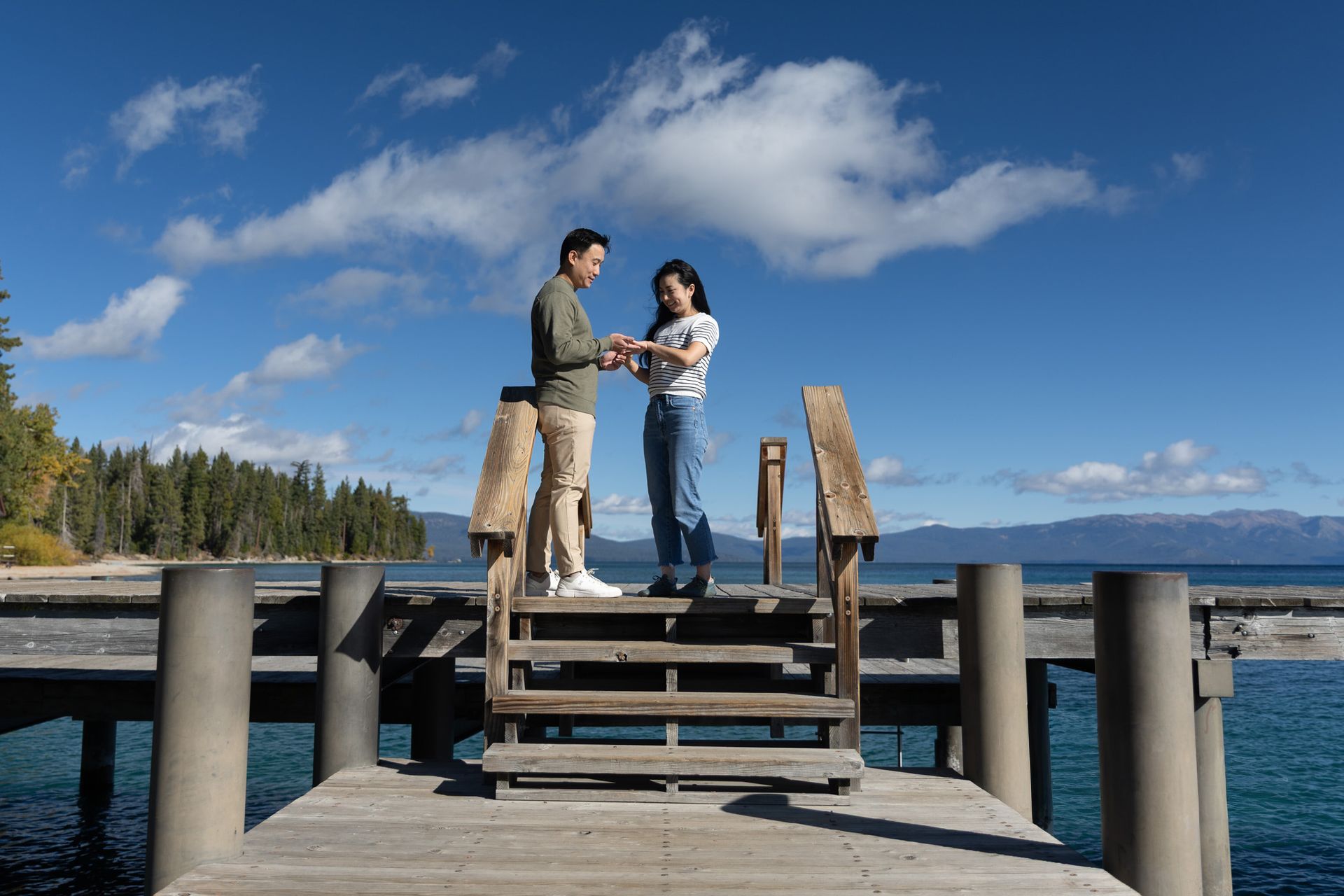 Wide shot of a Lake Tahoe proposal with mountain peaks and shimmering lake reflections