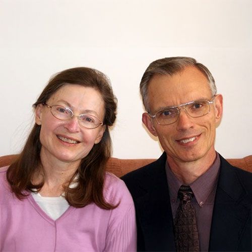A man and a woman are posing for a picture together