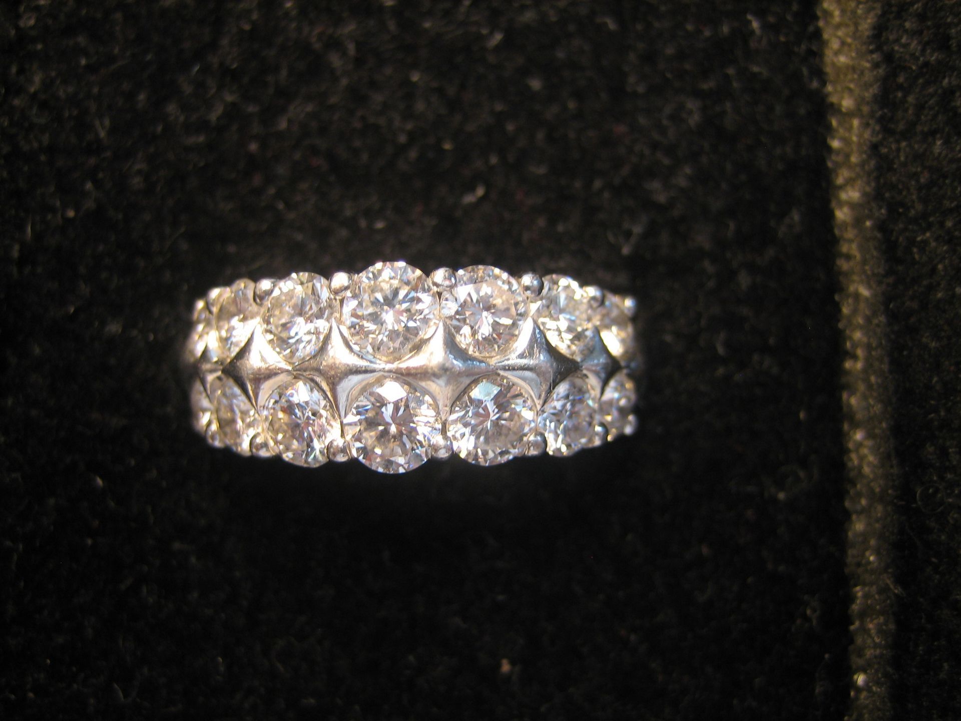 Diamond eternity ring, two rows of round brilliant cut diamonds, set in white metal.