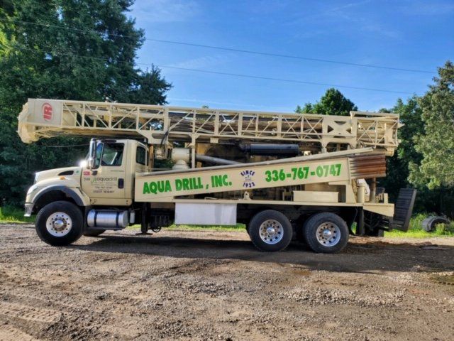Man Beside A Well Drill — Stoneville, NC — Aqua Drill Inc.