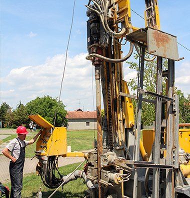 Man Operating Well Drill — Stoneville, NC — Aqua Drill Inc.