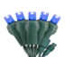 A bunch of blue christmas lights on green wires on a white background.