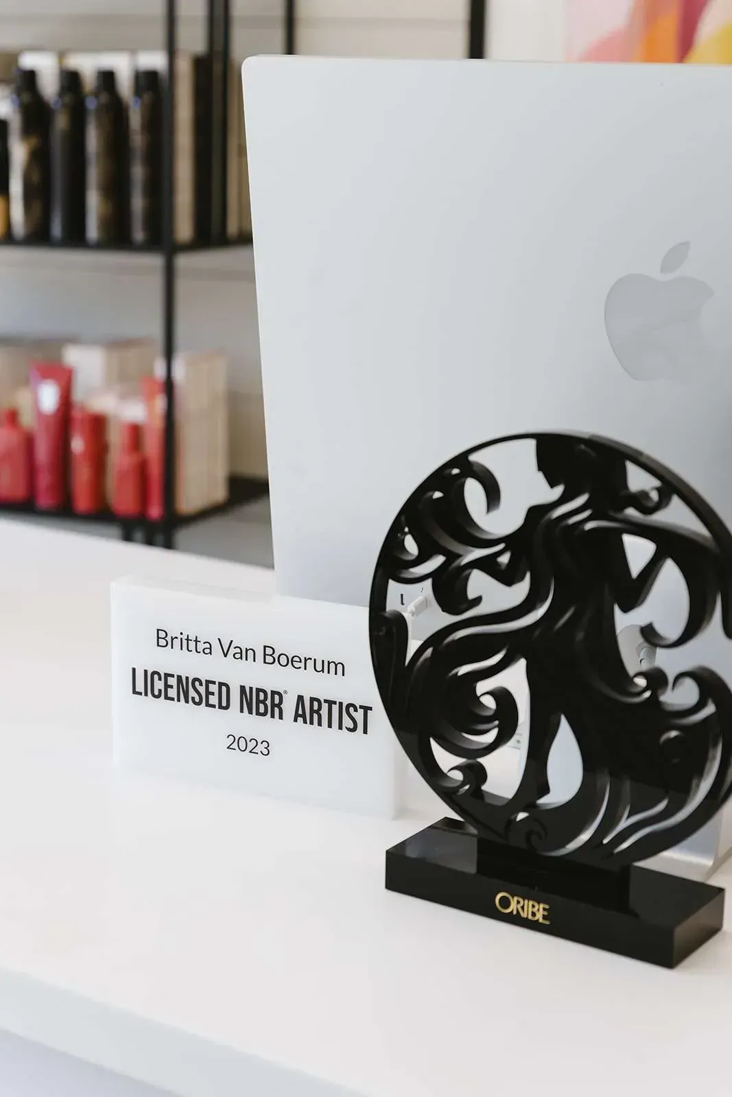 A desk with an award and a sign that says