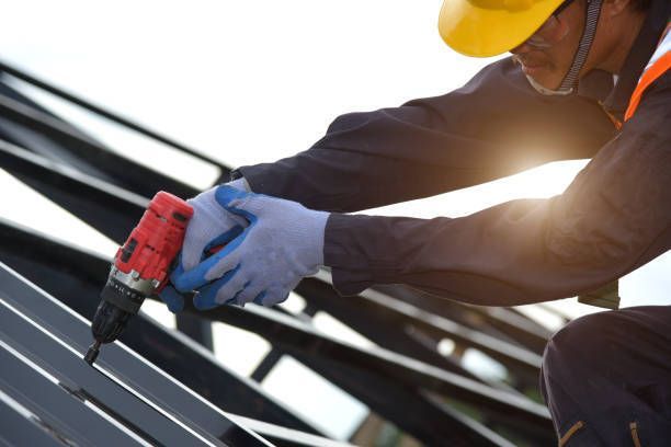 A man is working on a wooden roof with a hammer.
