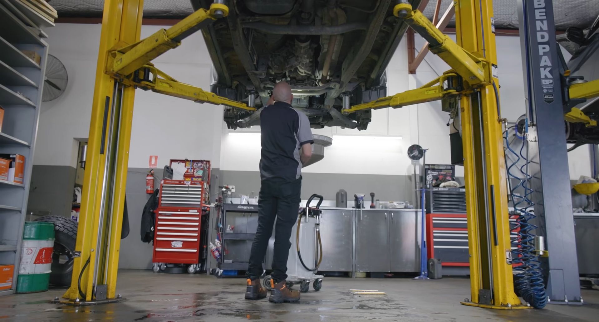 Red car in repair shop