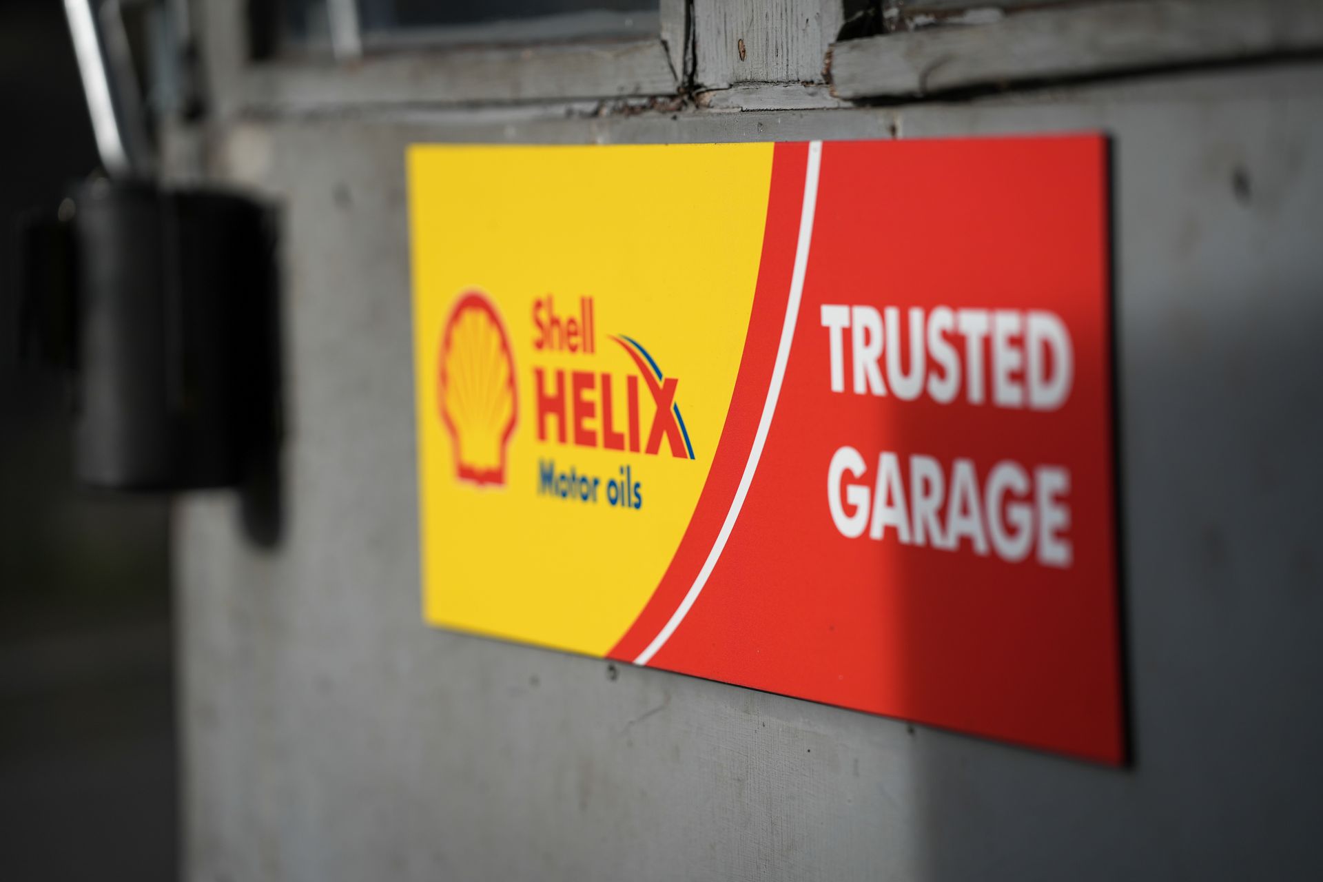 shell helix oil trusted garage sign on the workshop door