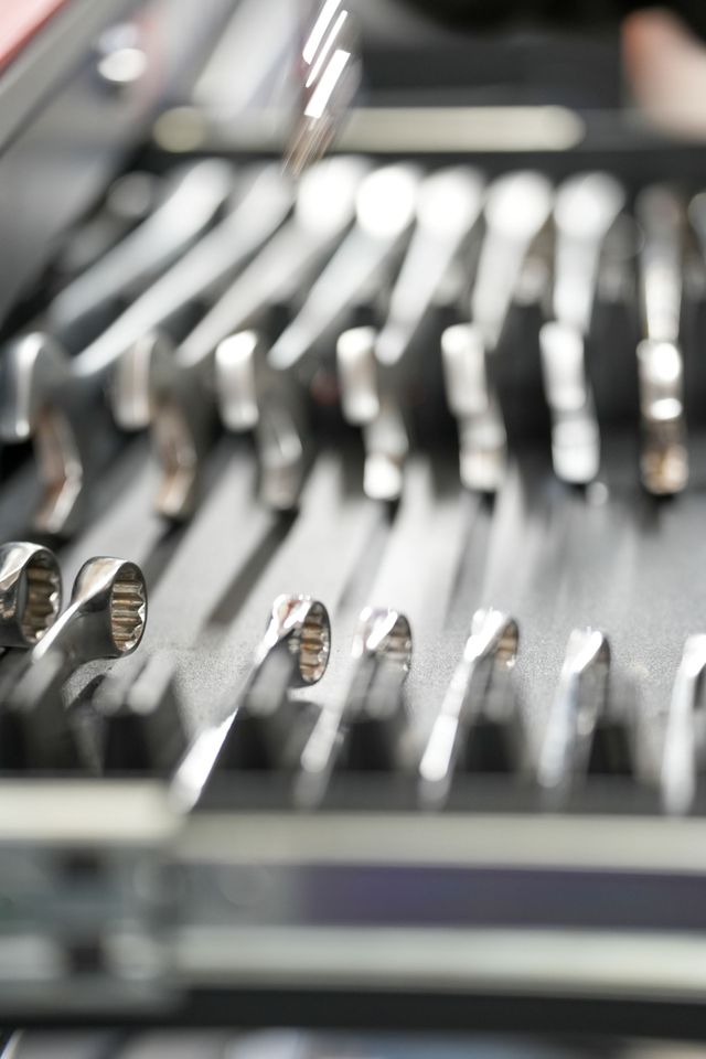 close up shot of spanners aligned neatly in a tool box draw 