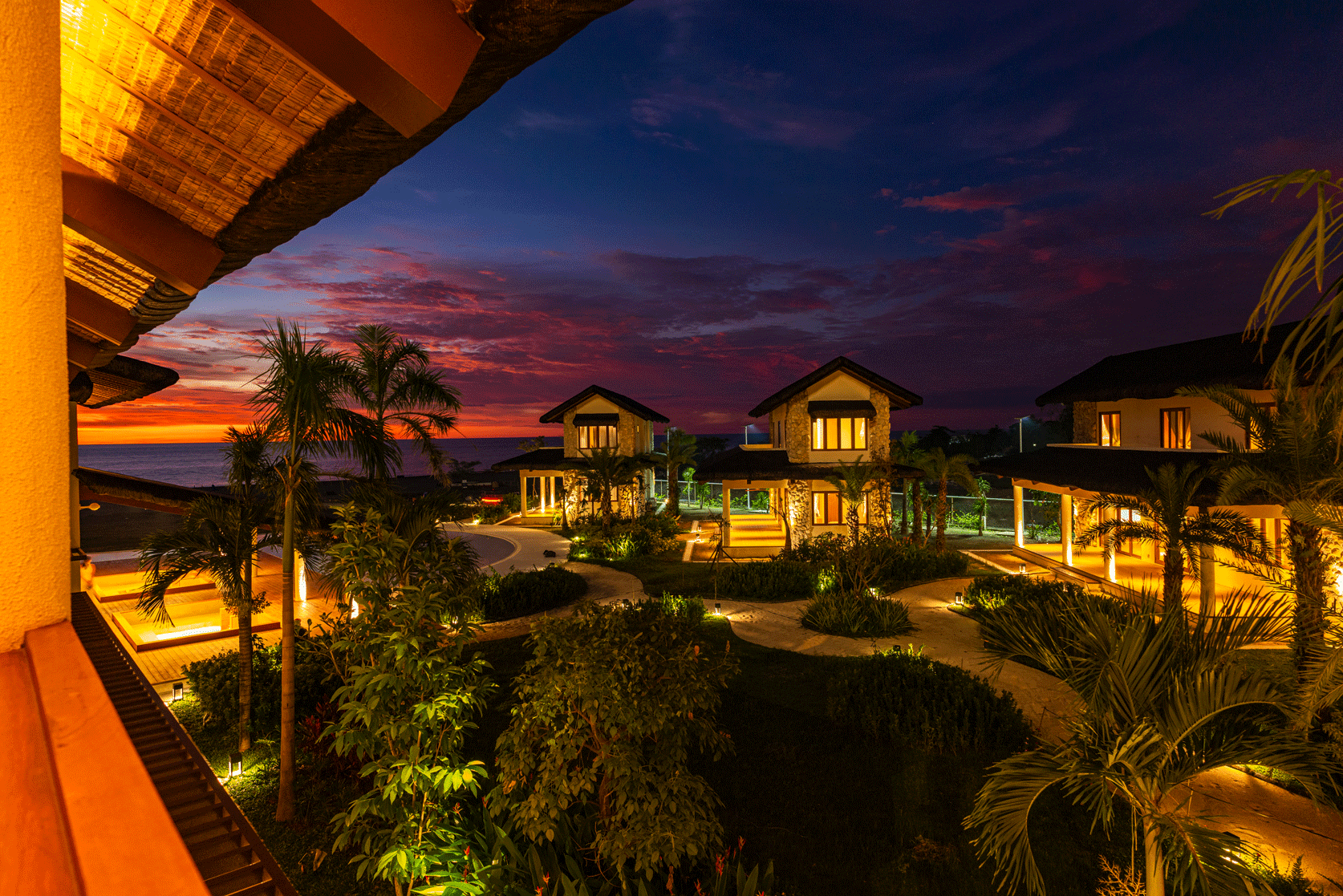 Harvest Hotel Cabanatuan luxury villas at sunset with tropical garden light