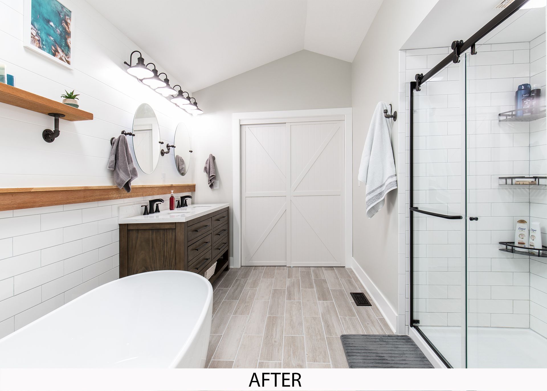 A bathroom with a bathtub , sink , and shower.