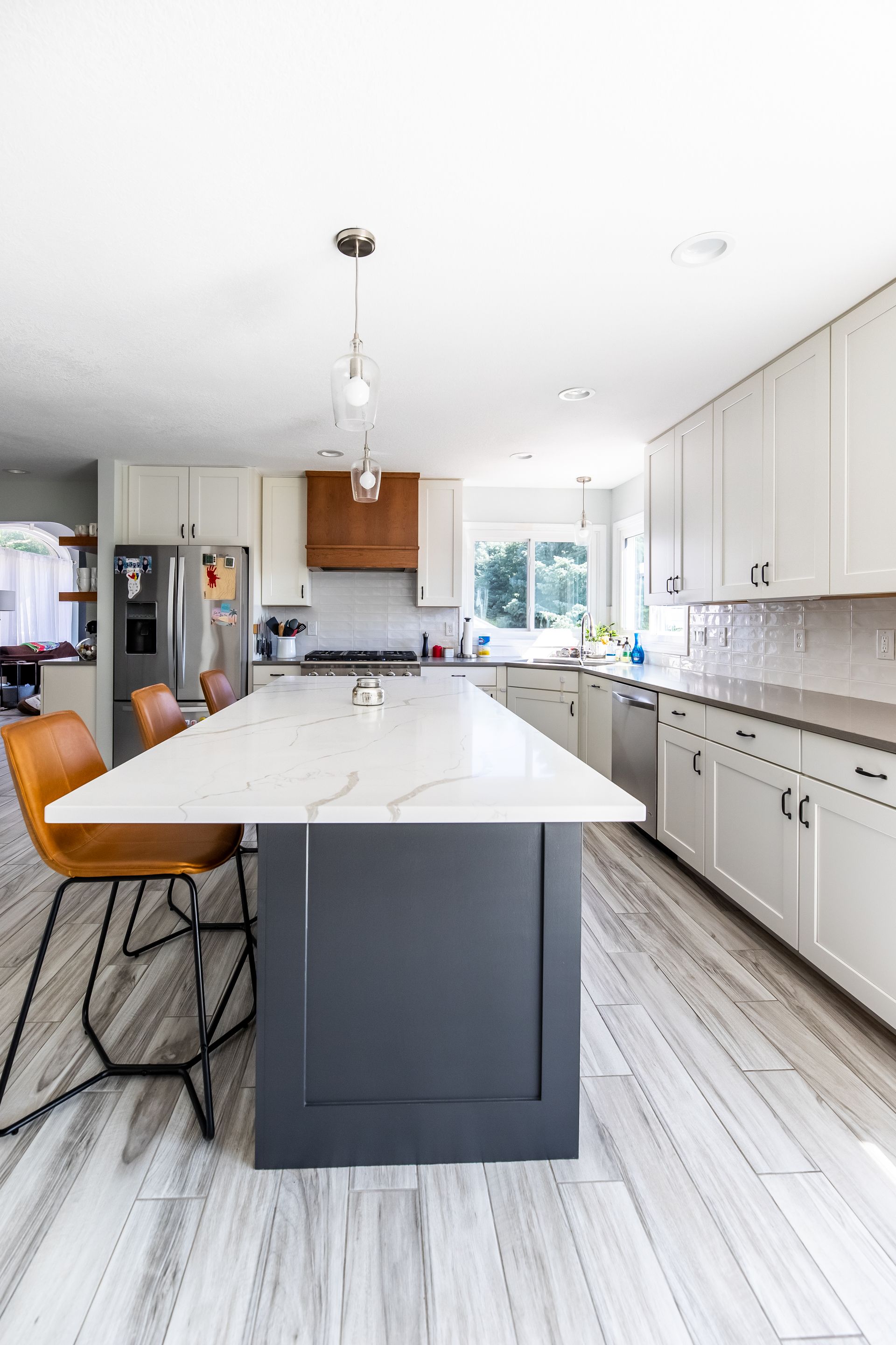 There is a large island in the middle of the kitchen.