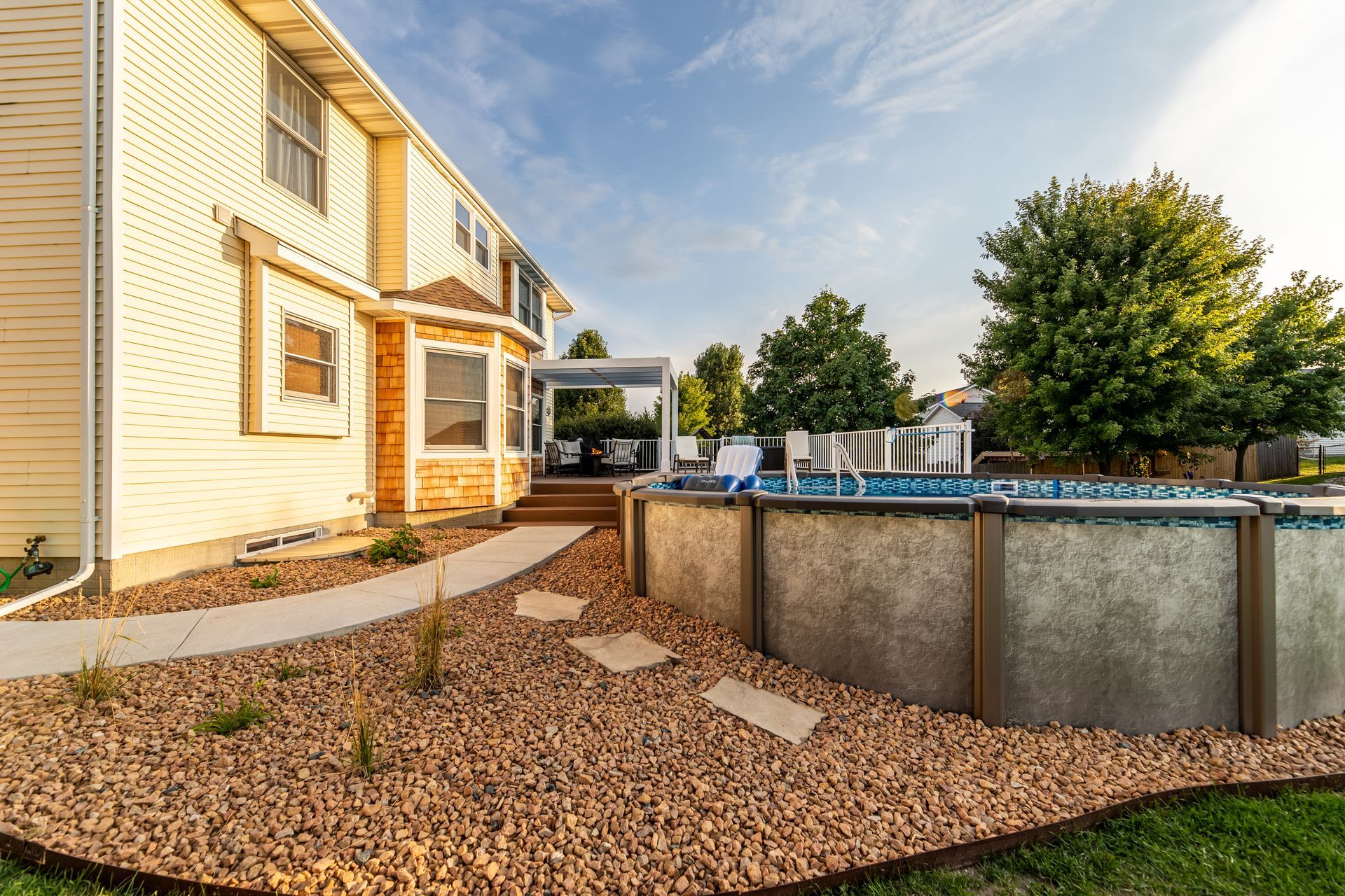 A large house with a swimming pool in the backyard.
