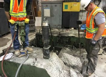 A large room with a red wall that says welcome