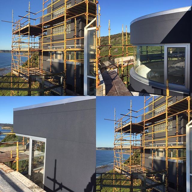 Man Installing Plasterboard — Newcastle NSW — T.K Cement Render