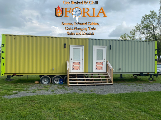 A yellow and green sauna trailer with the word uforia on it. sauna trailer and changing room