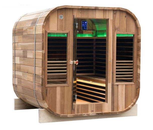 A wooden sauna with a green light on the door